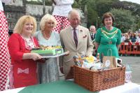 Prince Charles being presented with a hamper of local produce